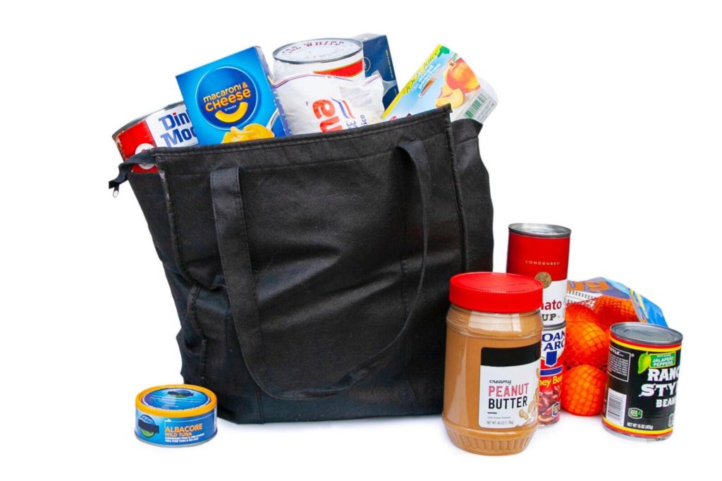 black bag full of food surrounded by more food