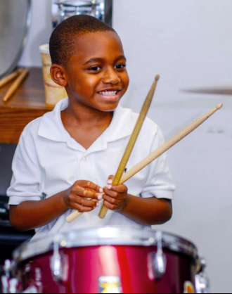 Jayden plays the drums