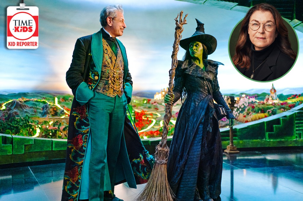 Scene from a fantasy movie showing a man in an ornate green suit and a woman with green skin dressed as a witch holding a broom. A small inset photo shows another woman with glasses, with a TIME for Kids Kid Reporter badge in the corner.
