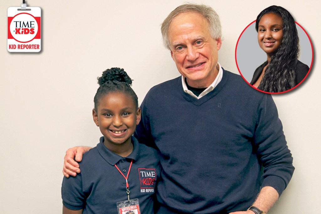 A smiling TIME for Kids Kid Reporter stands beside an older man with his arm around her. She wears a press pass, and a small inset photo shows another young woman.