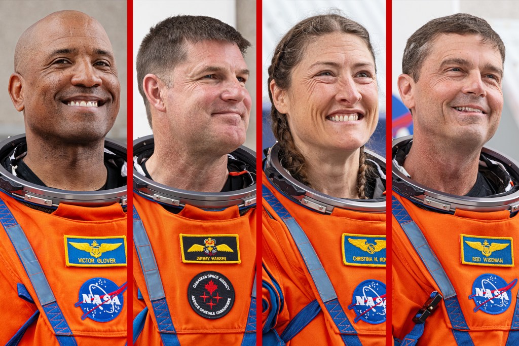 Four astronauts in orange spacesuits smile in side-by-side portraits.