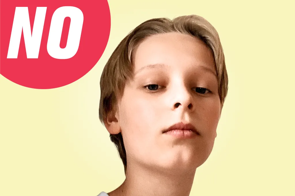 Close-up of a child looking down at the camera with a neutral expression, with a red speech bubble that says “NO.”
