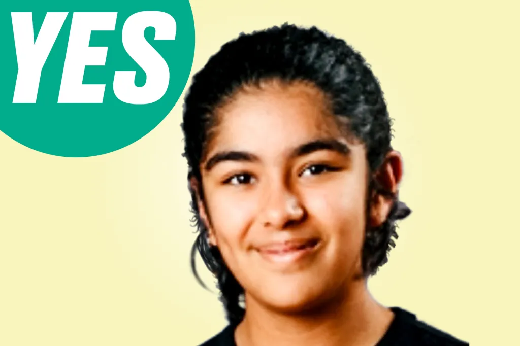 A smiling girl looks at the camera, with a green speech bubble that says “YES.”