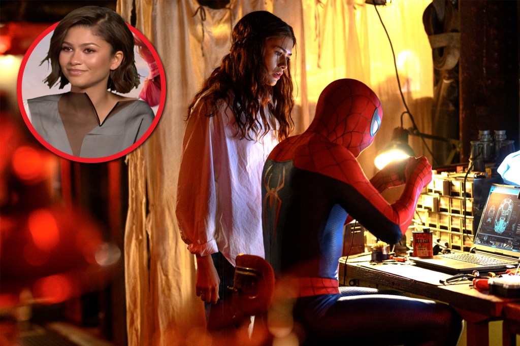 A person stands beside Spider-Man in a workshop filled with tools and equipment.
