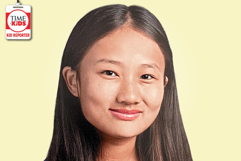 A smiling girl with long dark hair poses against a pale yellow background with a TIME for Kids Kid Reporter badge.