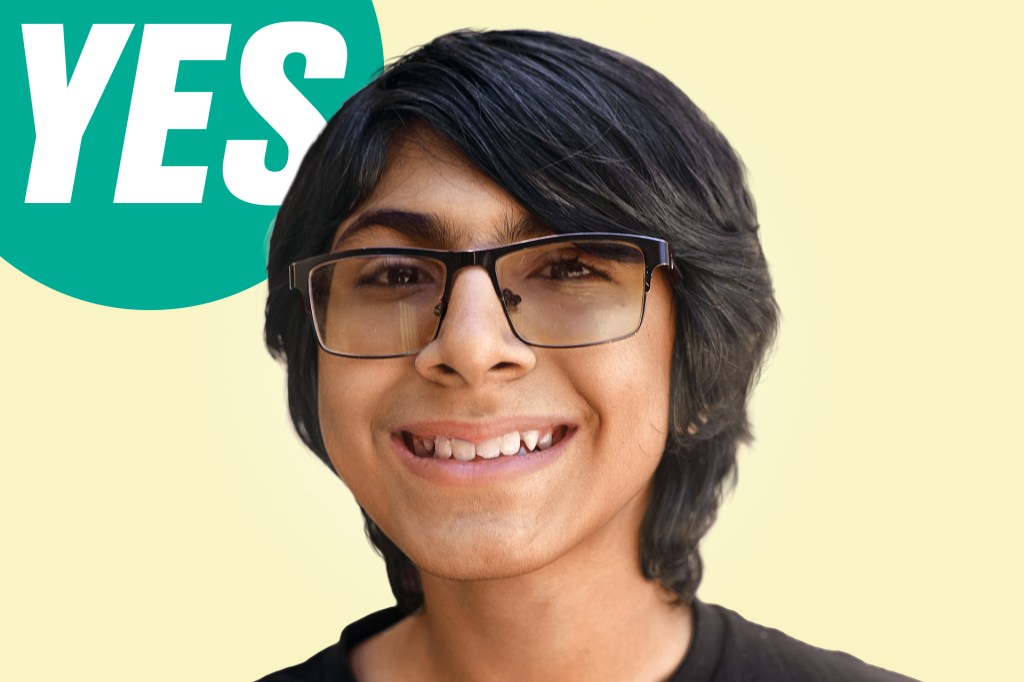 A smiling boy with dark hair and glasses appears next to a green “YES” speech bubble.